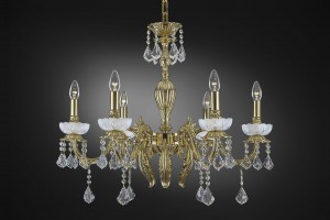 Crystal glass chandelier with candle bulbs and goldened center