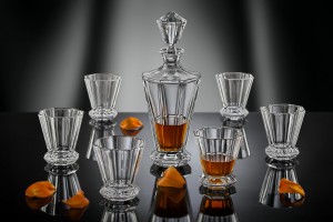 Set of whisky or rum glasses and bottle